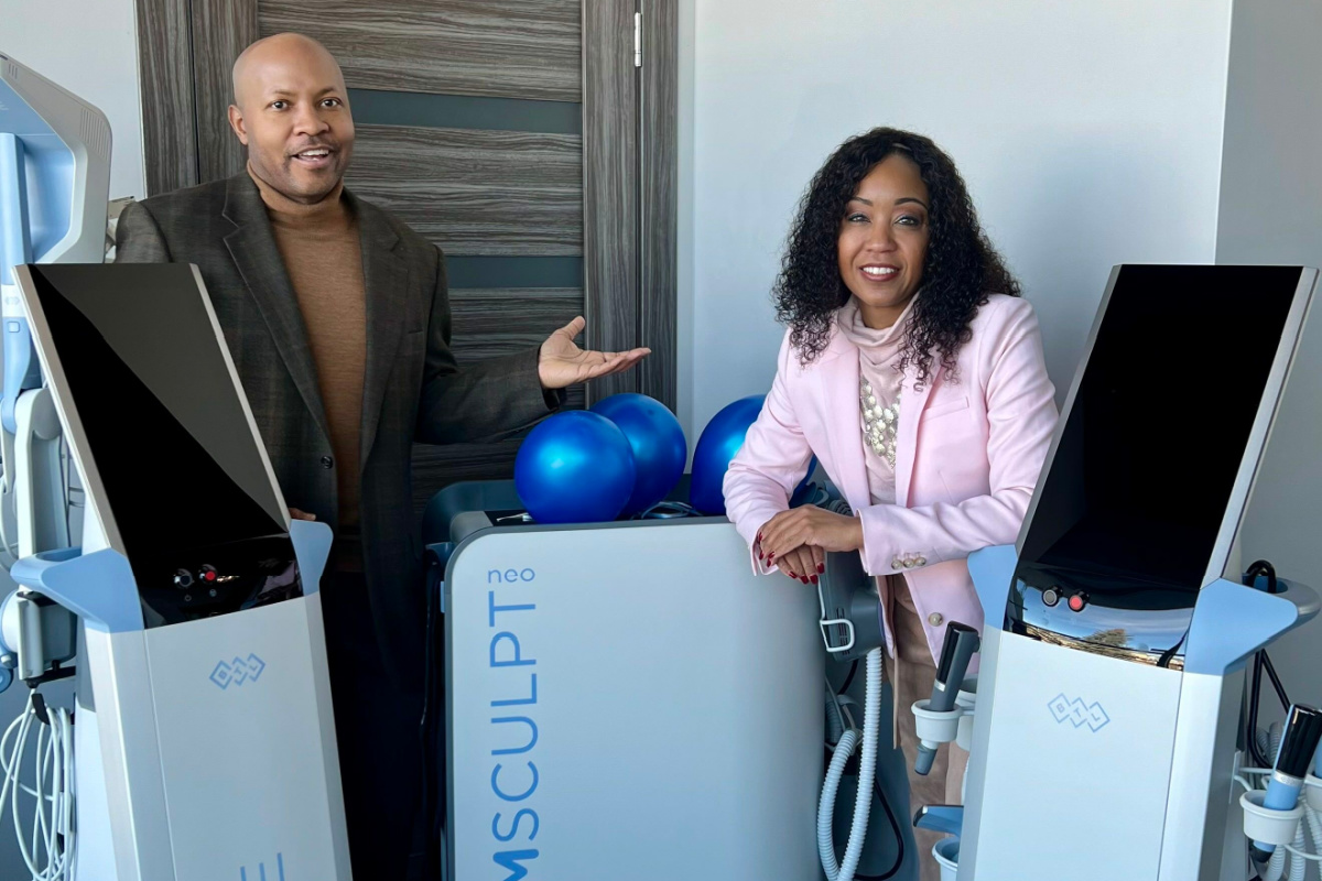 Drs. Marvin and Kenya Lee with EmSculpt Neo device at their Colorado Springs medical spa