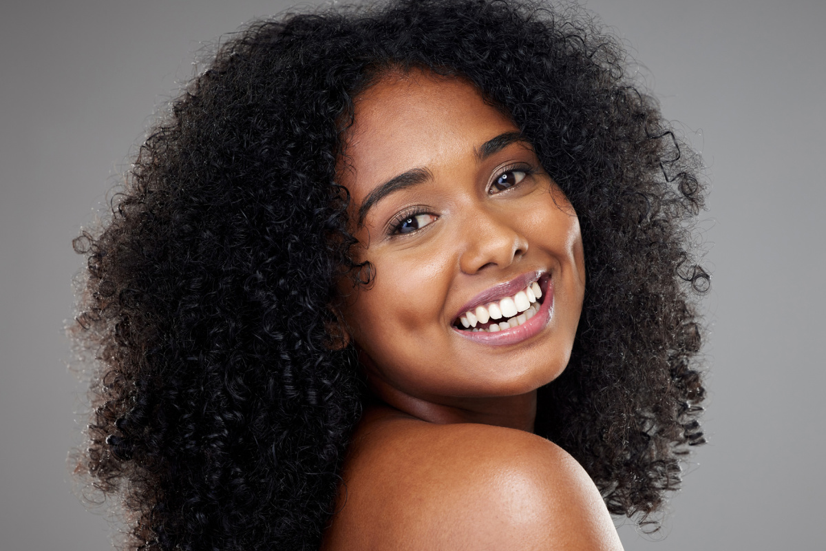 Close of up smiling early 30s African American woman with nice skin