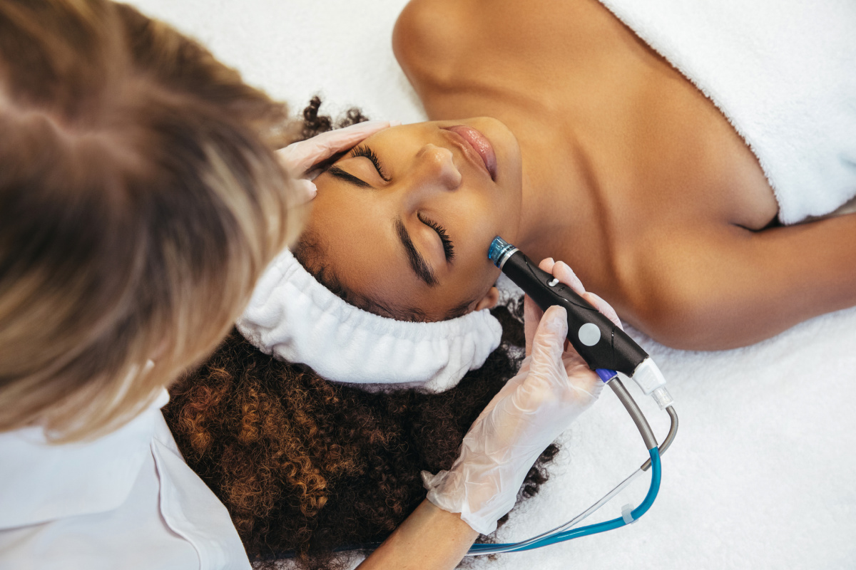 Woman getting hydrafacial at a med spa